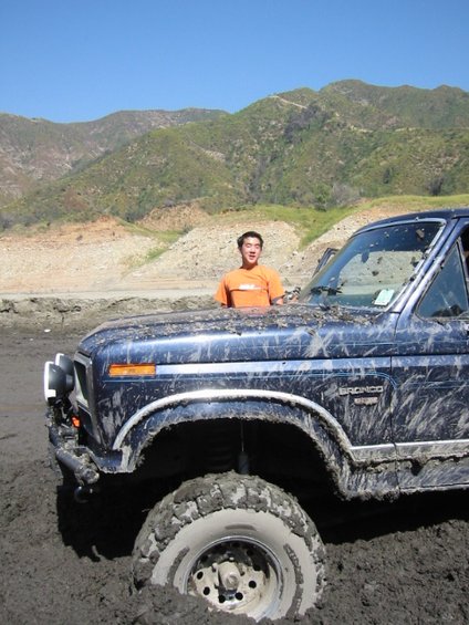 109-0974_img.jpg little brother Albert standing next to the bronco. hes 5'7"
