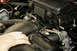 The air inlet tube simply pulls out of the air box. On the body end it's held in with a simple rubbe...