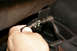 Remove this sensor fitting on the passenger side of the air box near the firewall by turning the gre...