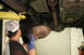 With the clamp loose, work the stock system free by pushing it towards the back of the truck while r...