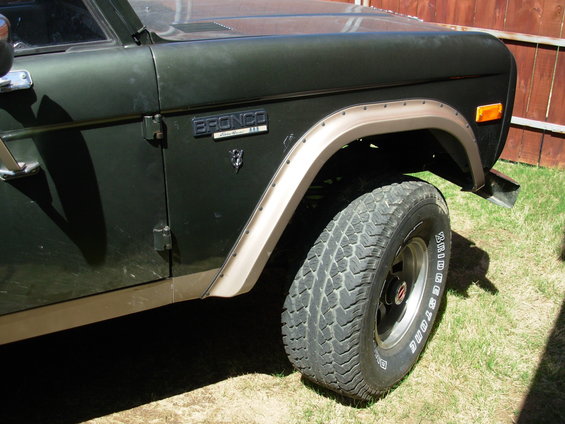 rn-v.jpg Help us choose which badges to use, & where. Vote in this thread:
http://fullsizebronco.com/forum/showthread.php?t=92233 

-V means the V8 badge is below the Bronco badge. 
(V) means it's in front of the wheel. 
N means the new style Bronco badge; O means old. 
If the V appears first in the filename, it means it's toward the front of the truck.