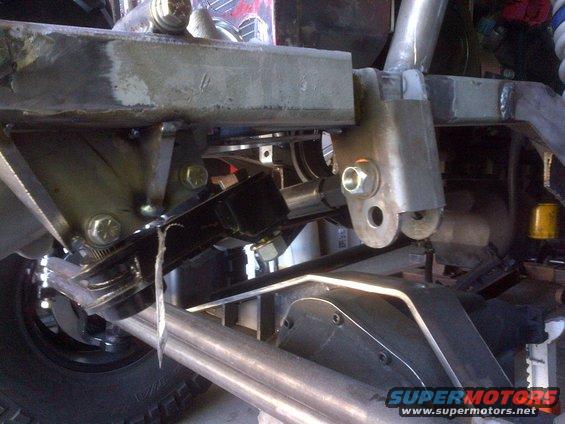 Close-up of custom suspension with Supermotors logo