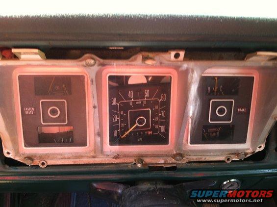 Dashboard with speedometer, fuel gauge, oil pressure gauge, and brake warning light