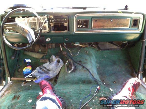 1978 Ford Bronco interior showing green carpet, dashboard, and steering wheel