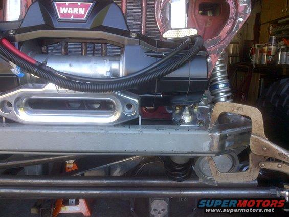 Jeep front end with WARN winch, custom bumper, and C-clamp