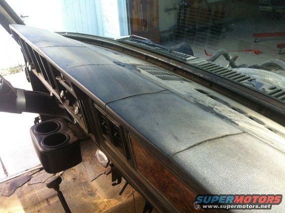 1979 Ford Bronco interior dashboard with cup holder and wood trim