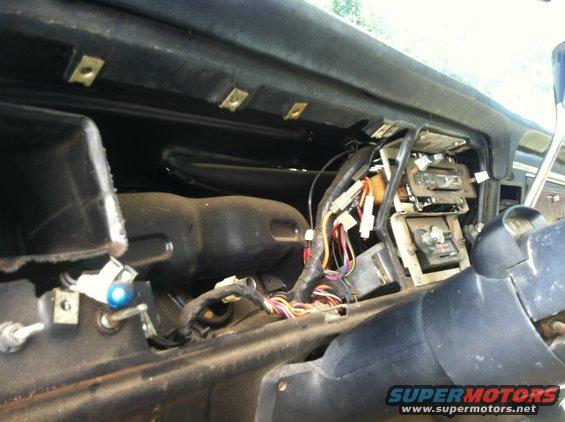 Interior view of exposed dashboard wiring and components