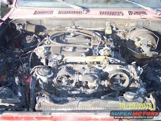 1991 Toyota Pickup/SR5 engine bay, red exterior, fire damage, visible engine components, date stamp 10/23/2013