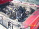 1991 Toyota Pickup/SR5 - Vehicle engine bay shows severe fire damage, with melted and charred components visible.