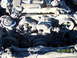 1991 Toyota Pickup/SR5 - The engine bay of a vehicle shows extensive fire damage, with charred components and melted debris obscuring most details.