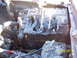 1991 Toyota Pickup/SR5 - The engine compartment shows extensive fire damage, with a melted battery and hoses visible.