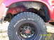 1991 Toyota Pickup/SR5 - Close-up of a vehicle's wheel well and tire, with a date stamp visible.