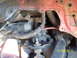 1991 Toyota Pickup/SR5 - Close-up view of engine bay components, including a starter motor and various hoses, with a red painted frame.