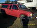 1991 Toyota Pickup/SR5 - This 1991 Toyota Pickup is parked outdoors with its hood up, showing the engine bay.