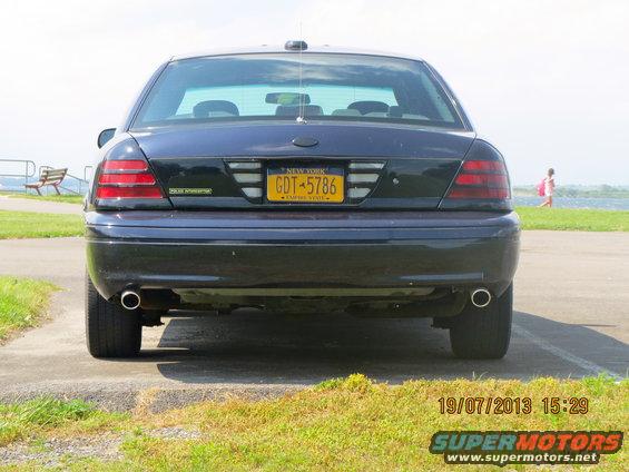 Rear view of a dark sedan with a New York license plate reading GDT-5786