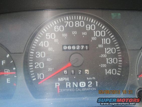 Dashboard gauges showing 66,271 miles, with the gear selector on 'R'