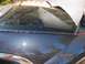 1998 Lincoln Mark VIII - Close-up of the rear window seal on a 1998 Lincoln Mark VIII.