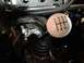 2004 Ford Crown Victoria - Close-up of a white 6-speed manual shift knob with gear pattern visible.
