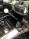 2004 Ford Crown Victoria - Interior view of a car's dashboard and floor, with a Hurst shifter prominently displayed.
