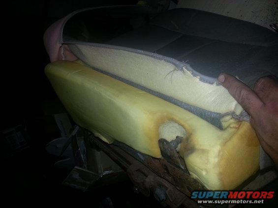 car seat foam showing damage and exposed springs