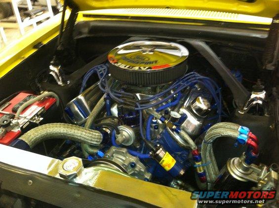 Yellow 1963 Ford Ranchero engine bay with V8 engine and chrome air cleaner