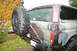1989 Ford Bronco - This Ford Bronco, painted in camouflage, is equipped with a rear-mounted spare tire and a custom bumper.