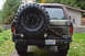 1989 Ford Bronco - This 1989 Ford Bronco features a rear-mounted spare tire and a distinctive camouflage paint scheme.