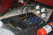 1989 Ford Bronco - The vehicle's interior features a custom console with auxiliary switches and gauges, alongside a mounted fire extinguisher.