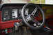 1989 Ford Bronco - The interior of this vehicle features a custom steering wheel and aftermarket gauges.