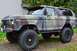 1989 Ford Bronco - This 1978 Ford Bronco features a camouflage paint scheme and significant off-road modifications.