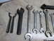 2004 Aston Martin Virage - A variety of wrenches and tools are laid out on a tiled surface.