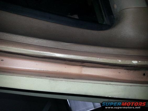 Close-up of the interior door sill area of a vehicle