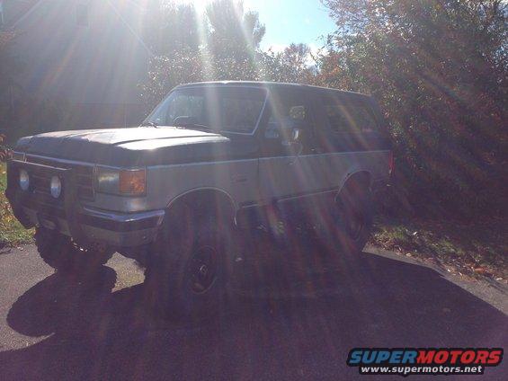 Ford Bronco parked on a sunny day, side and front visible