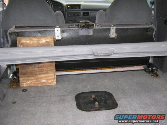 1996 Ford Bronco interior cargo area with folded rear seat and wooden supports