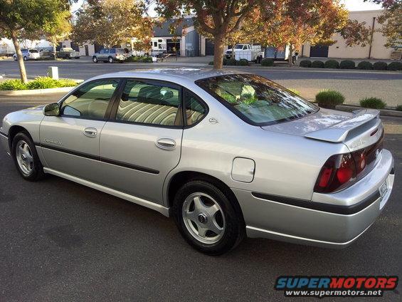 Silver 2001 Chevrolet Impala sedan, rear 3/4 view