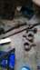 1992 Ford Bronco - Driveshafts and axle components are visible on the floor, possibly for a Ford Bronco.