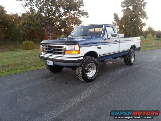 Blue and white 1994 Ford F-250 pickup truck, 3/4 front view