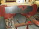 1964 Ford Fairlane - Car firewall area undergoing repair with a metal patch and chalk markings, showing front suspension components.