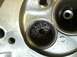1978 Ford Bronco - Engine cylinder head detail with debris in one of the valve seats.