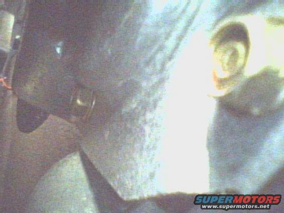This is a side shot showing the lower bolt behind  the lower dimple.