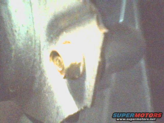 The third bolt clearly visible but you still need to use a speed or box wrench to remove it.