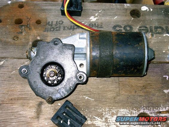Motor looks different then the other write up for a 92 and 96 I have seen. Also note, the 1/4 - 28 nuts suggested by Steve83 were too big for my window motor. I had to use 1/4 - 20 bolts and even then they were a little tight. 