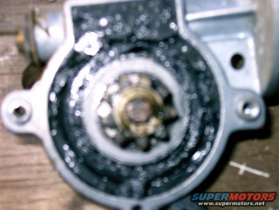 Again too blurry but all the black stuff is the grease with what is left of the original plastic plugs.