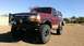 1996 Ford Bronco - This lifted Ford Bronco is equipped with a heavy-duty front bumper and winch, ready for off-road adventures.