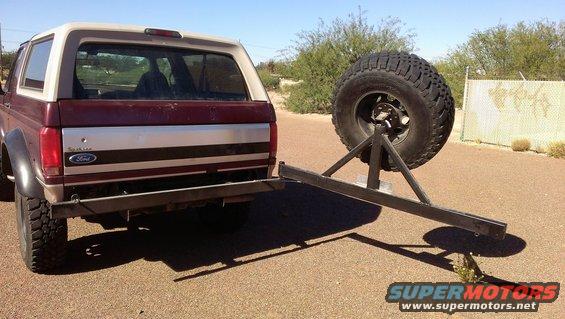 Rear view of a 1996 Ford Bronco with a custom spare tire carrier attached to the bumper