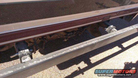 1996 Ford Bronco rear bumper with trailer hitch and maroon trim