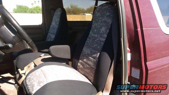 1996 Ford Bronco interior showing front seats with digital camo covers and steering wheel