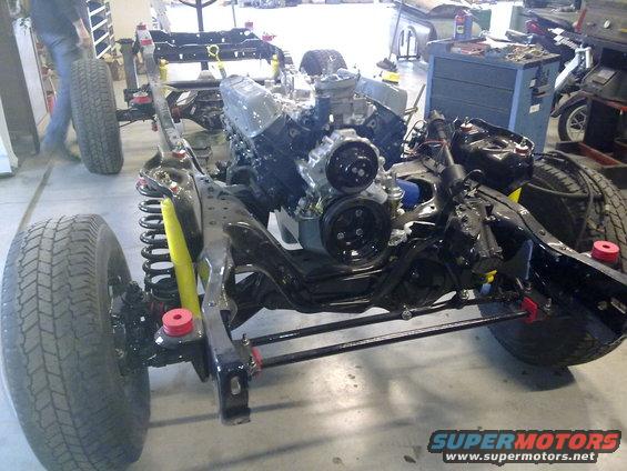 Chassis with engine and suspension components, front view