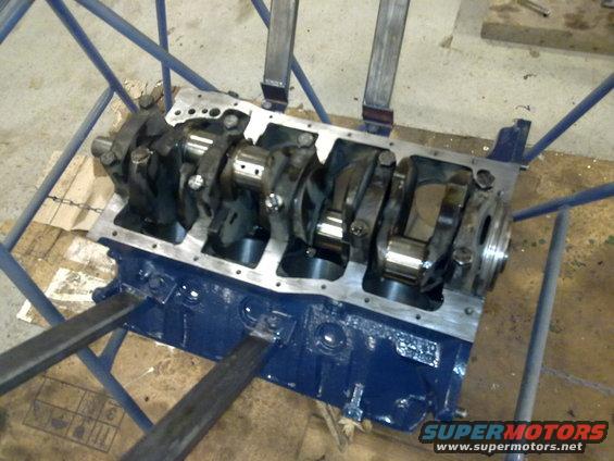 Engine block with crankshaft and connecting rods, blue paint
