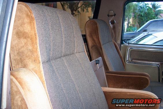 Interior view of 1986 Ford Bronco showing front seats with patterned fabric and brown velour trim